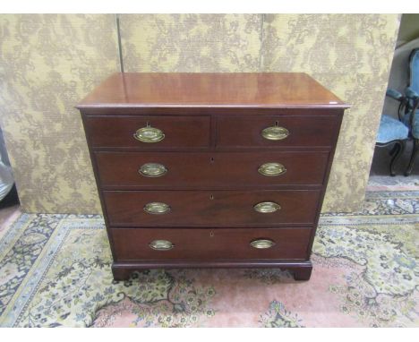 A Georgian mahogany chest of three long and two short drawers raised on bracket supports, 87cm high, 93cm x 50cm 