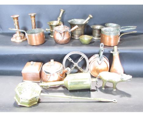A mixed selection of copper ware, including a tea caddy, a pair of candlesticks, a powder horn, and some brass ware including