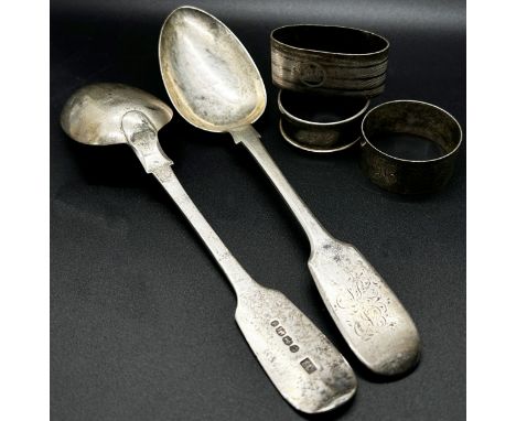 A mixed selection of silver, consisting of a pair of 19th century serving spoons, three napkin rings, a pickle fork, and six 