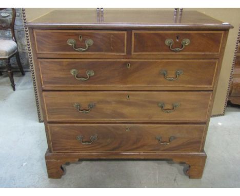 A Georgian mahogany bedroom chest with crossbanded detail, of two short and three long graduated drawers raised on bracket su