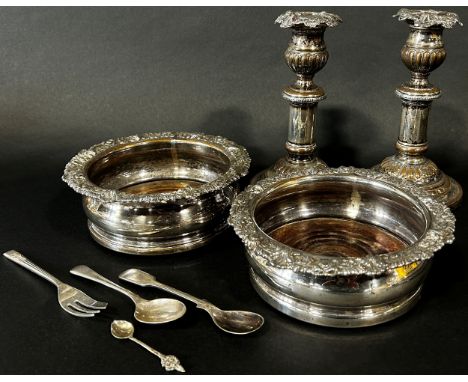 Two silver plated wine coasters and a pair of candlesticks and three spoons and fork (8) 