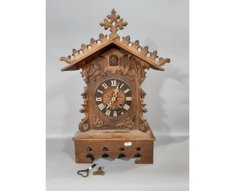 A 19th century Tyrolean bracket cuckoo clock, the casework in the form of a chalet with cuckoo and gong strike 