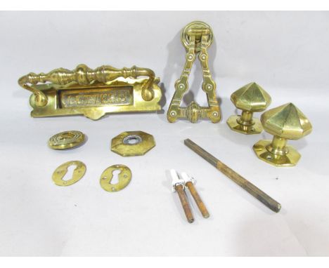 Victorian brass door furniture, consisting of a letter box, door knocker, a pair of door knobs, key hole and fixings.