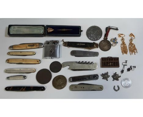A collection of vintage pen knives, Victorian medallions, tiny wooden abacus and cabinet items 