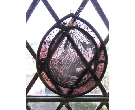 An enamel washing basin and two enamel jugs, a gold carved angel, a watering can and a stained glass leaded panel of The Owl 