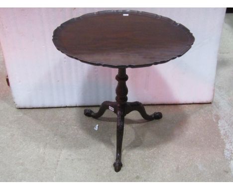 A good quality Georgian style mahogany snap top occasional  table of oval form with pie crust border raised on a wrythen vase