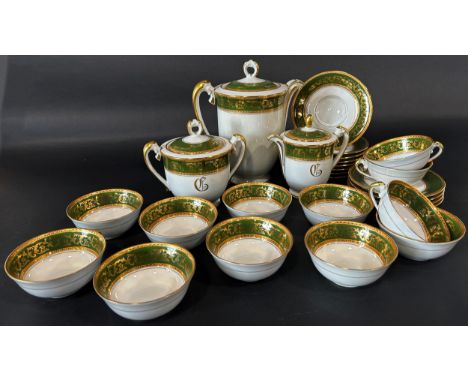 A Limoges porcelain tea service, cups, sugar basin, teapot, etc together with a leaf shaped serving plate 
