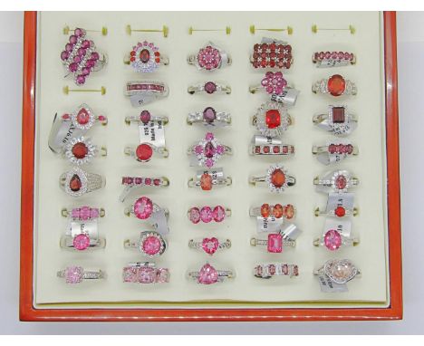 Collection of red - pink gem set silver dress rings, to include ruby, pink sapphire, garnet, tourmaline, andesine and topaz e