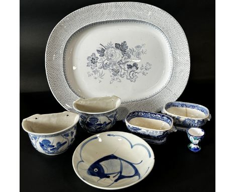 Blue and white ceramic 'Royal Granite' meat platter, two Chinese wall planters, two willow pattern dishes, a fish bowl, 5 Iro