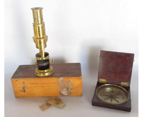 A Nairne &amp; Blunt mahogany cased compass with a hinged cover, together with a 19th century portable brass field microscope