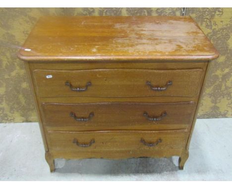 A continental oak commode of three long drawers with shaped apron and swept forelegs, 82 cm high x 90 cm wide x 50 cm deep, t