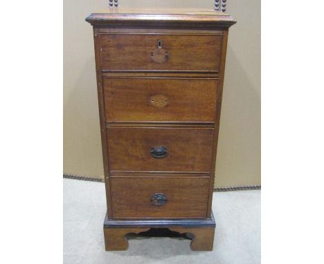 A 19th century oak chest  four pedestal chest set on bracket feet, 102 cm high x 49 cm wide x 48 cm deep 