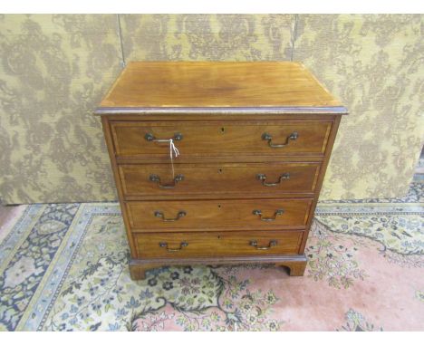 A George III style mahogany chest of for graduating long drawers of diminutive proportions, with strung and crossbanded inlai