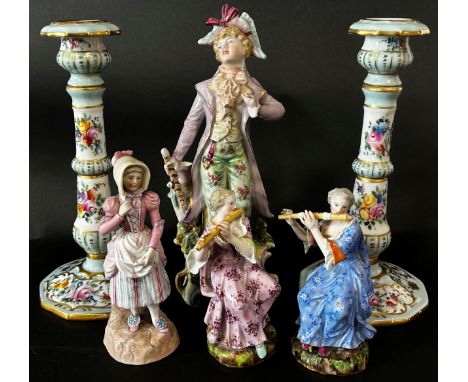Pair of 19th century Meissen ceramic figures, female musicians playing pipes, a further 19th century continental figure of a 