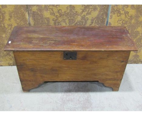 A simple antique elm countrymade boarded coffer with hinged lid, steel lock plate and bracket shaped supports, 48 cm high x 9