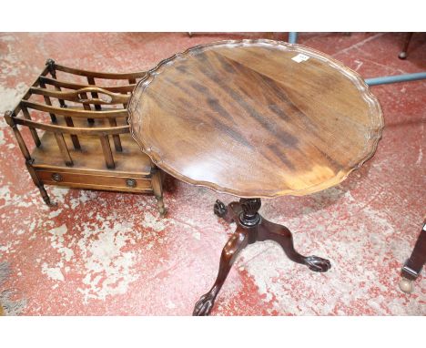 A George III style mahogany pie crust table with tilt top, acanthus carved column and tripod base with ball and claw feet and