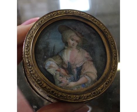 An ivory trinket box with portrait miniature to lid and gilt metal mounts, 6.5cm in diameter 