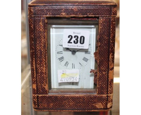 A carriage clock in travelling case, 14.5cm high including handle