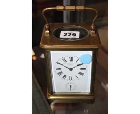 A carriage clock, Goldsmiths & Silversmiths Co Ltd. Regent Street, London on dial, 18cm high including handle 