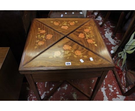 An Edwardian floral inlaid envelope card table 56cm wide 