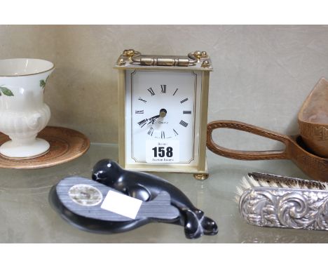 A decorative Servres style Easter Egg, two Inuit seals, brass effect carriage clock and pair of wooden Love Spoons and other 