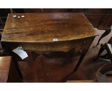 A George III bow front mahogany side table, with three frieze drawers 84cm wide 