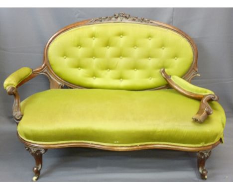 WALNUT FRAMED SOFA with oval button backed upholstery with intricate carving and similar spoon-backed chair