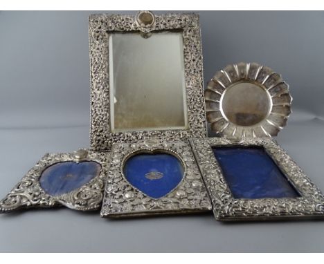 THREE PIERCED SILVER PHOTOGRAPH FRAMES, a similar easel mirror, 29.5 x 22.5cms Birmingham 1848, various London and Birmingham