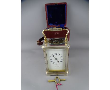 SILVER PLATED BRASS CASED CARRIAGE CLOCK in original carry case with key, the dial signed 'Tarori Southampton', 16.5cms heigh