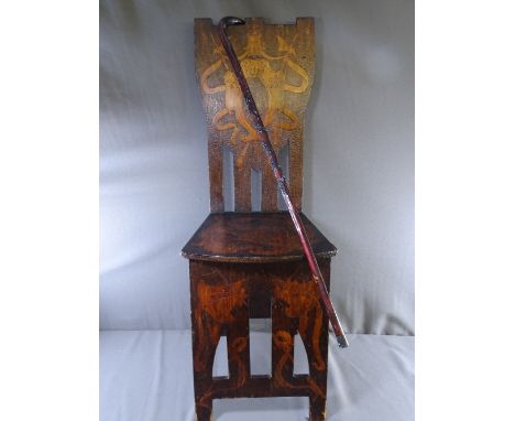 EISTEDDFOD POKERWORK CHAIR and a walking stick with raised carving