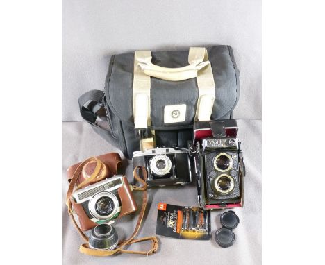 YASHICA MAT-124G DUAL LENS CAMERA in case, a Karl Zeiss Jena Werra I in leather case and an Agfa Isolette III, all in a moder