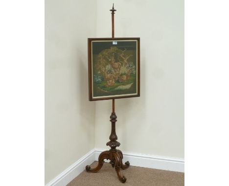 Mid Victorian walnut pole screen on carved tripod base, fitted with adjustable needle work panel 