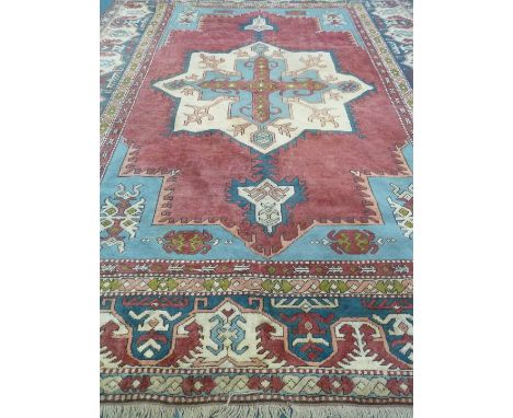 Large Turkish geometric pattern red ground rug carpet with beige border, 360cm x 265cm