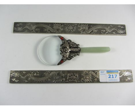 Chinese white metal paperweights and a magnifying glass with jade handle