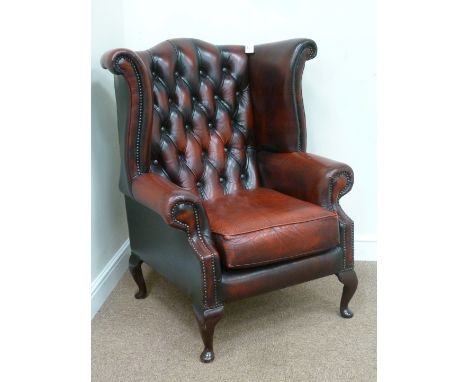 Georgian style wing back armchair upholstered in burgundy leather