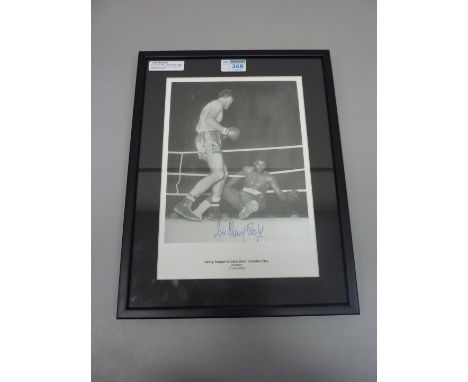 Sporting Memorabilia - 'Henry Cooper knocks down Cassius Clay - Wembley 19th June 1963' photographic print signed by Sir Henr