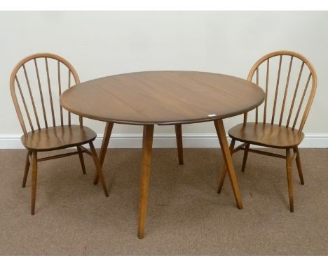 Ercol Golden Dawn elm oval drop leaf dining table (113cm x 123cm (open)), and two stick back chairs