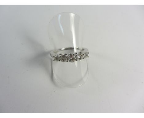 Diamond graduating five stone ring stamped 750 approx 1 carat total