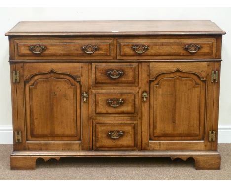 Quality reproduction walnut dresser of small proportions fitted with five drawers and two cupboards, crossbanded in yew wood,