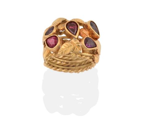 An 18 Carat Gold Ruby Ring, by Helen Newman, the broad ring of wire and twisted wire form, overlaid with leaf motifs and five