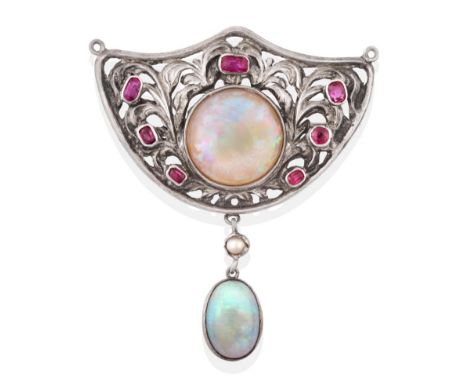 An Arts &amp; Crafts Style Opal and Ruby Brooch, the shield motif set centrally with a circular cabochon opal with vari-cut r