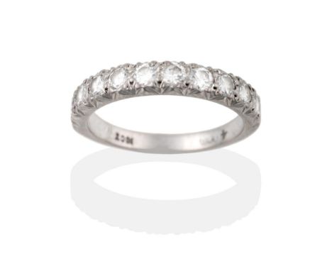 A Diamond Half Hoop Ring, ten round brilliant cut diamonds in white claw settings to a tapering plain polished shank, total e