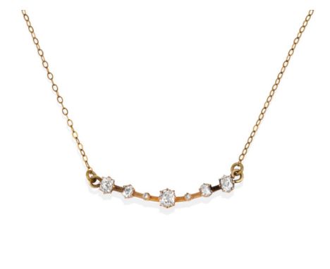 A Diamond Necklace, of a curved panel set with seven old cushion cut diamonds in yellow claw settings, to a trace link chain,