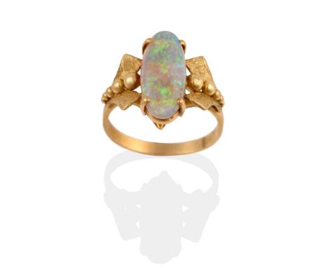 A Synthetic Opal Ring, an oval cabochon opal in a yellow four claw setting, to fancy polished bead and matte finished forked 