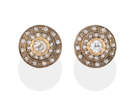 A Pair of Diamond Cluster Earrings, a central old cut diamond with two rows of old cut diamonds around, in yellow crimped and