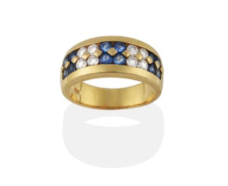 A Sapphire and Diamond Ring, alternating clusters of four round cut sapphires and four round brilliant cut diamonds in yellow