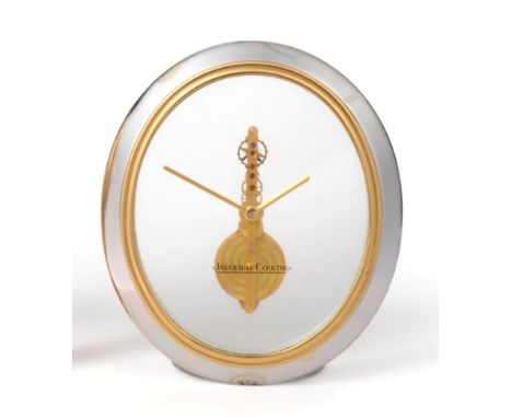 A Silvered and Gilt Metal Oval Shaped Mantel Timepiece, signed Jaeger LeCoultre, circa 1984, visible single line lever moveme