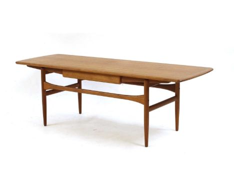 A teak Scandart coffee table, 151cm long Provenance: The estate of Robin and Patricia Pickard