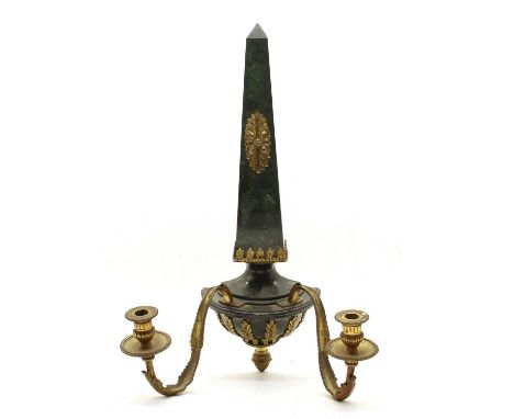 An Empire design twin light wall sconce, the faux marble surmount and base embellished with gilt metal mounts, fitted twin le