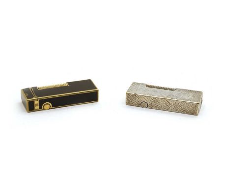 Two Dunhill lighters, one in black enamel with gilt edges and roller, the other silver plated with an all over cross-hatched 